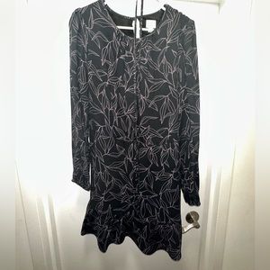 Black dress with floral pattern and tie for waist. Size M